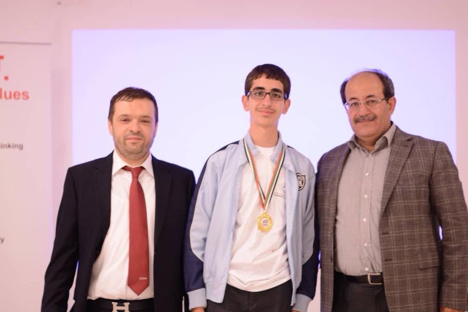 JOI gold medal winner celebrating on stage